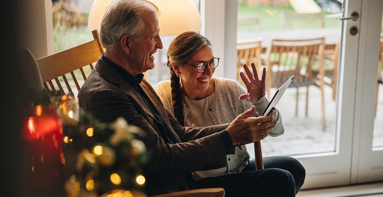 elderly couple on tablet during holidays