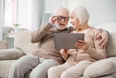elderly couple on tablet