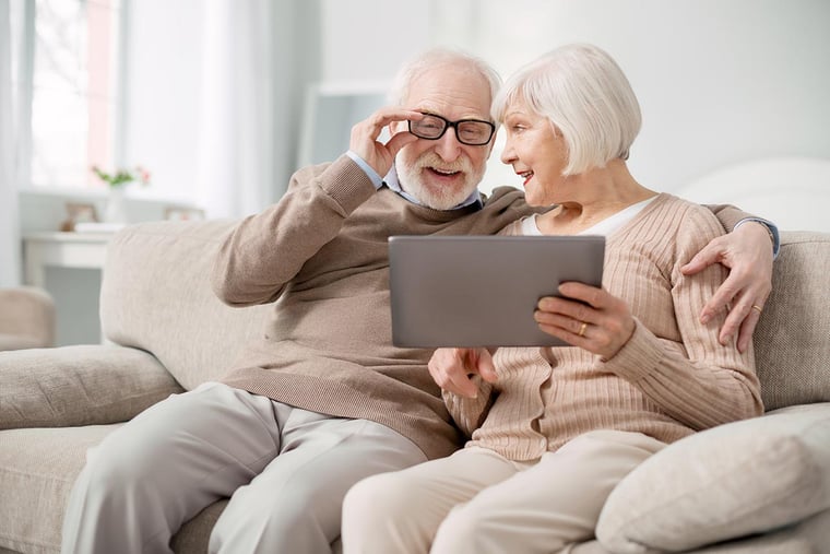 elderly couple on tablet