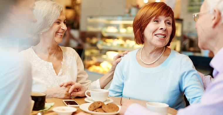 elderly friends at a cafe