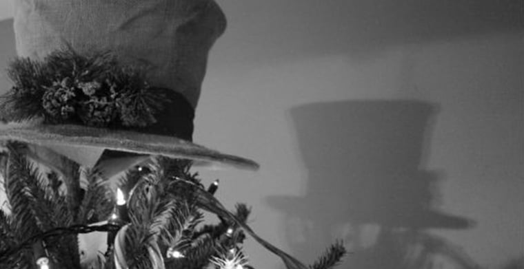hat on top of christmas tree