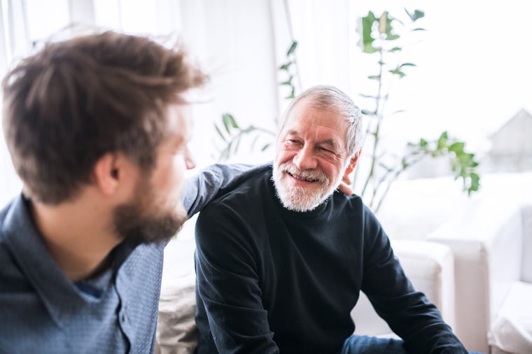 two men sitting together