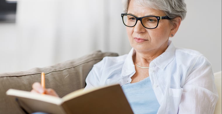 woman writing in journal