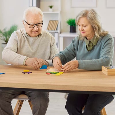 Senior couple working on a puzzle.