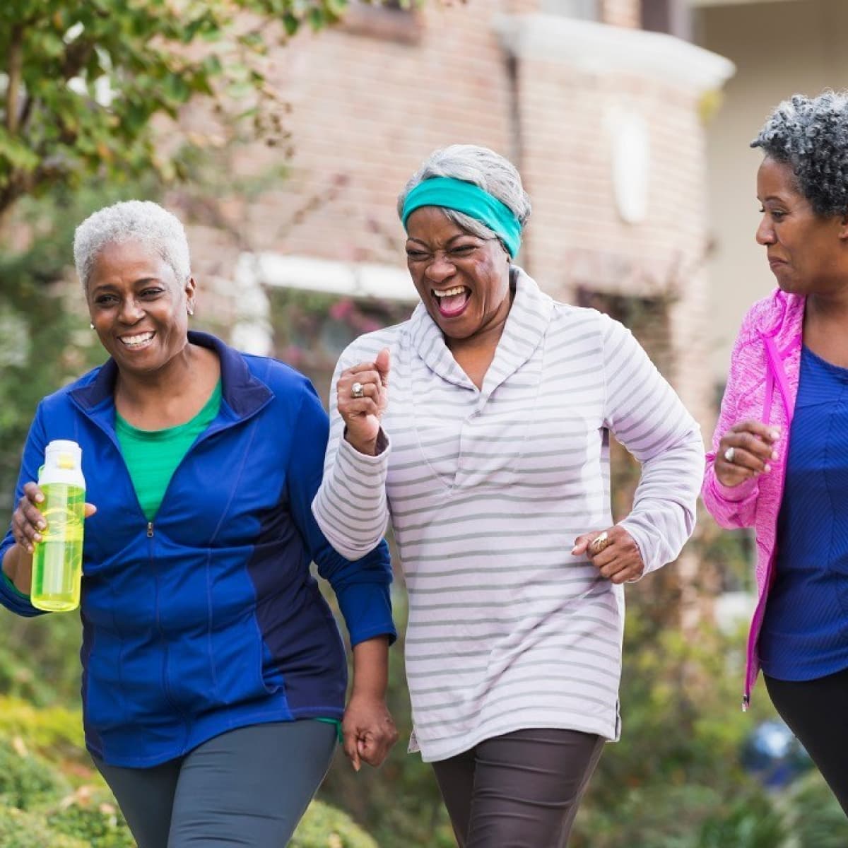 Several female seniors enjoy a walk together.