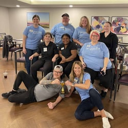 After many scrimmages with resident sharks in bean bag baseball, Copper Shores Village staff finally took the trophy.