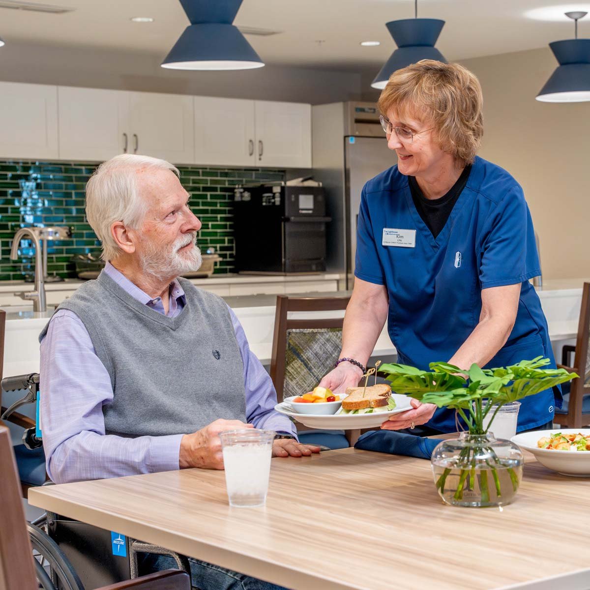 employee-serving-senior-lunch-1200x1200