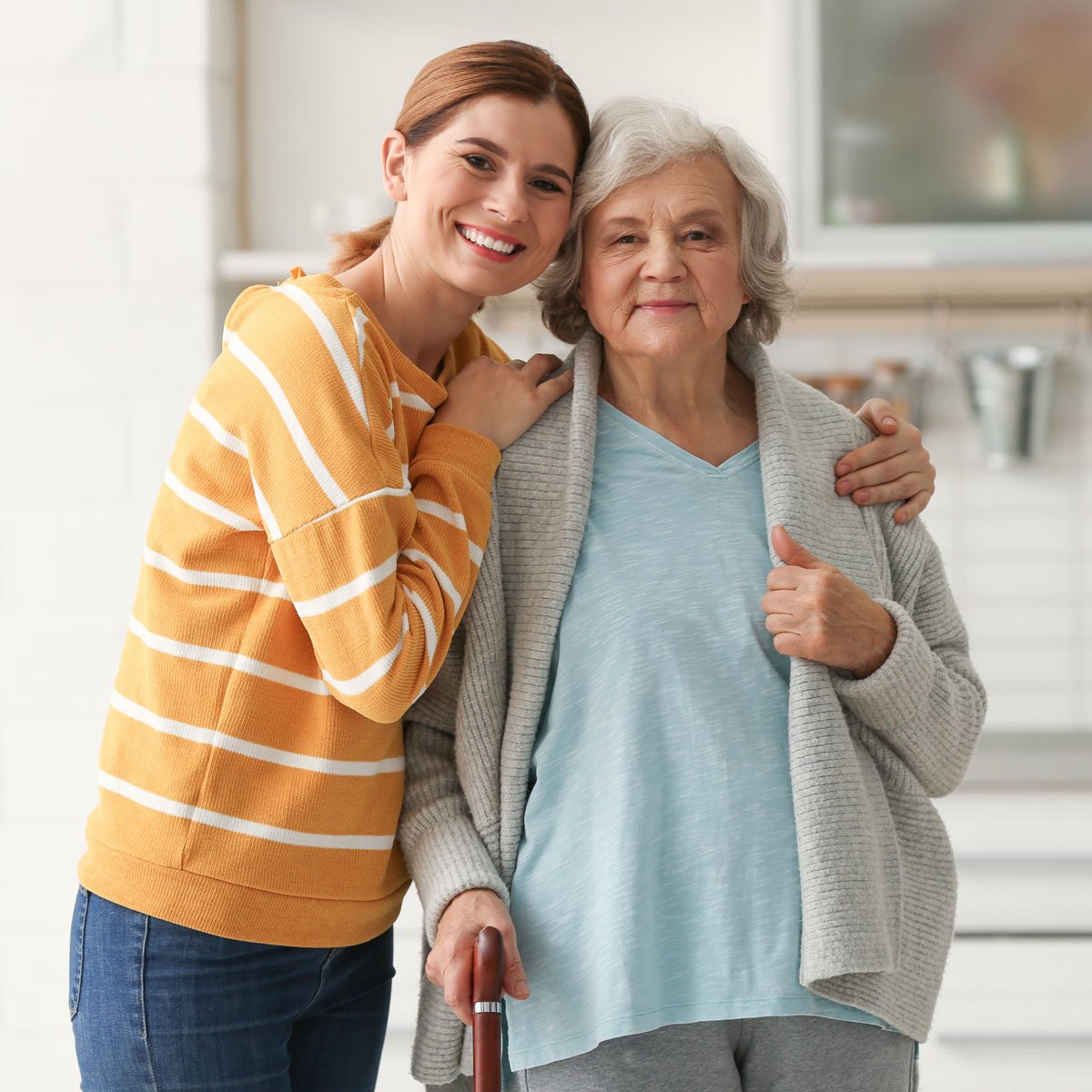 An adult daughter and her senior mother.