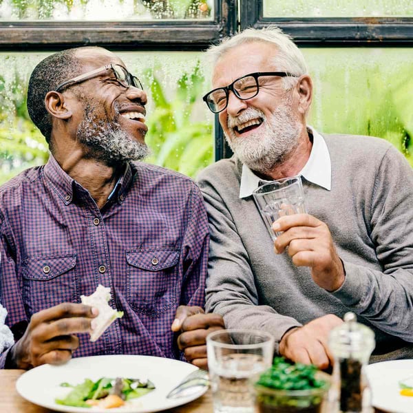 Two senior friends having lunch together