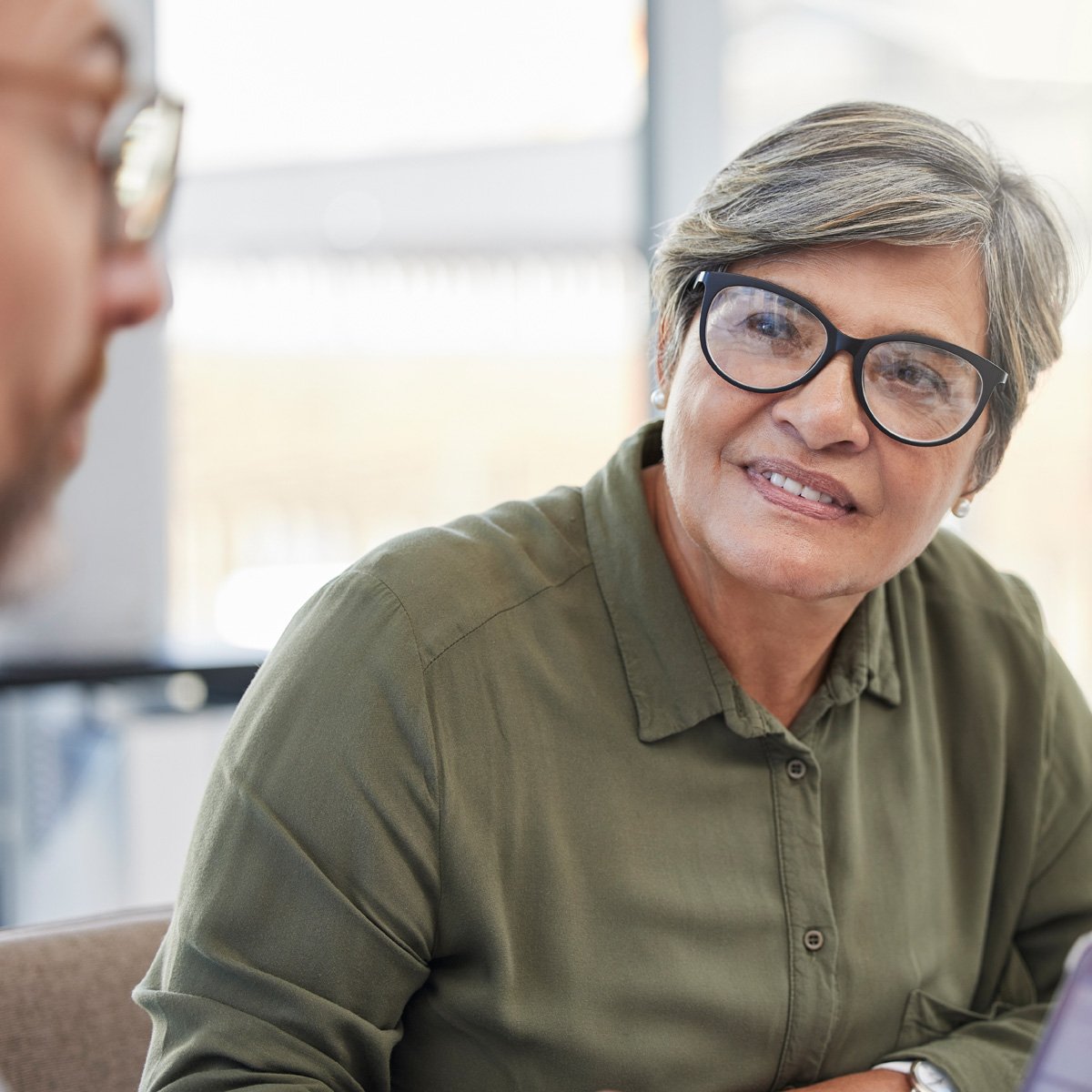 professional-senior-woman-in-meeting-1200x1200
