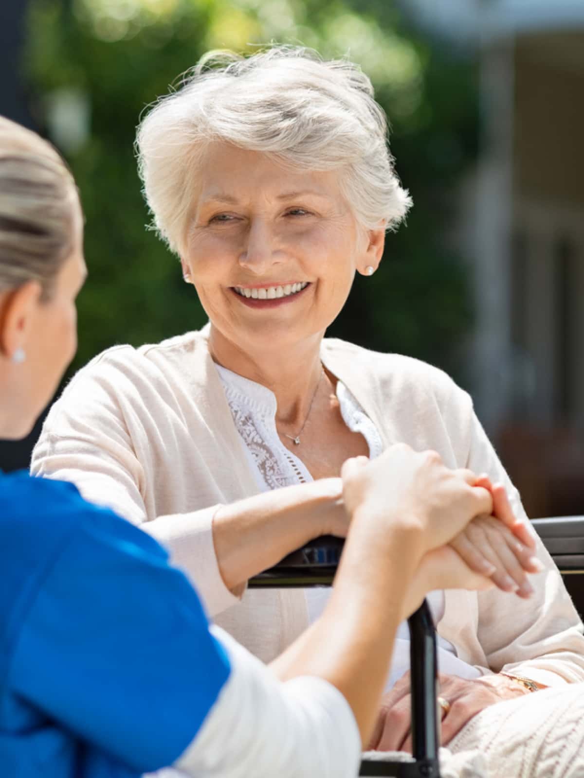 A nurse talks with a memory support resident.