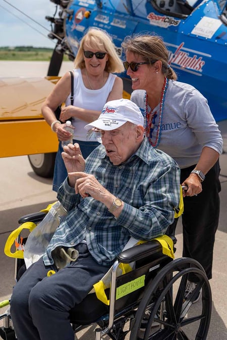 Beth Nodes, Immanuel Vice President of Experience, assists a resident during a Dream Flight in Lincoln, Nebraska.