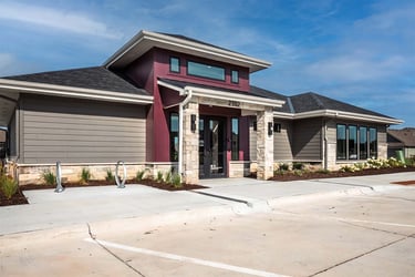 Immanuel instructor supporting elderly woman rock climb.