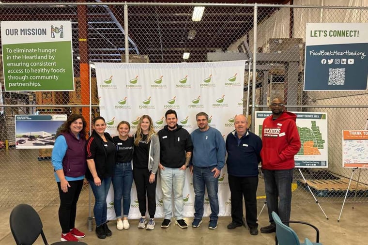 Arboretum Village leaders volunteered at Food Bank for the Heartland.