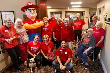 Staff and residents at Arboretum Village celebrate the first Husker football game.