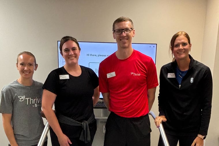 Members of Immanuel Village's wellness team gather to celebrate the installation of their Dividat Senso system.