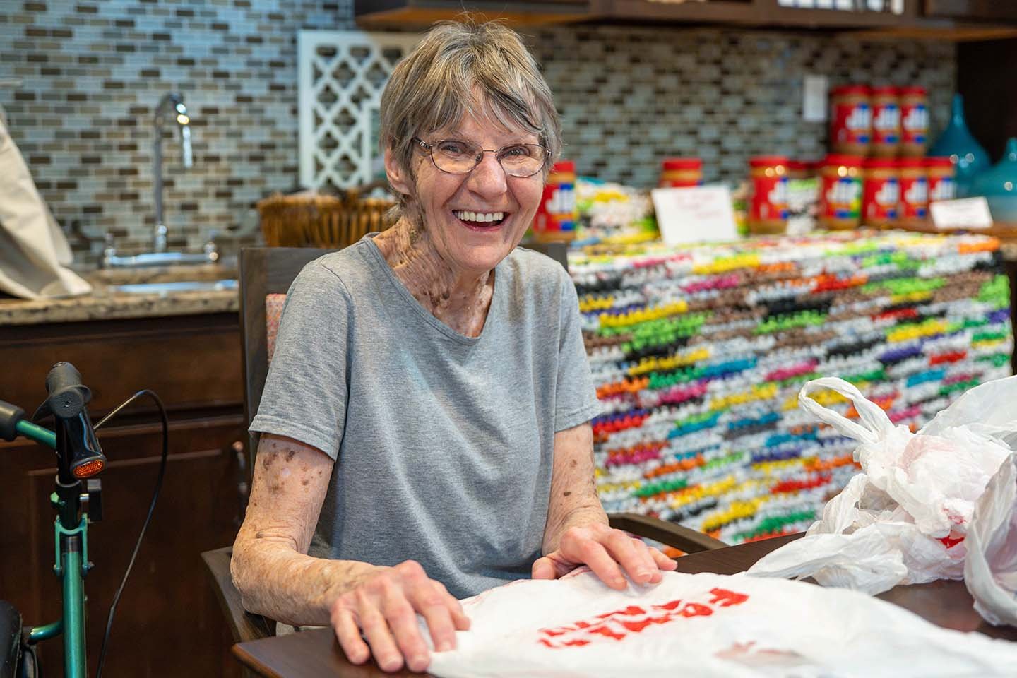 Residents at Pacific Springs in Omaha transform recycled plastic bags into lightweight sleeping mats for people experiencing homelessness.