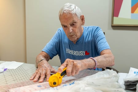 Residents at Pacific Springs in Omaha transform recycled plastic bags into lightweight sleeping mats for people experiencing homelessness.