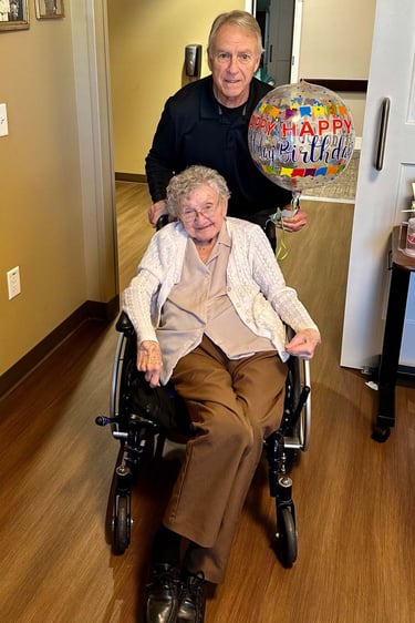 Bill Swanson and his mother, Joan, on her 100th birthday at Newport House in Omaha.