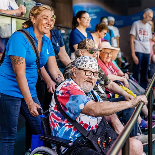 Senior man at zoo exhibit.