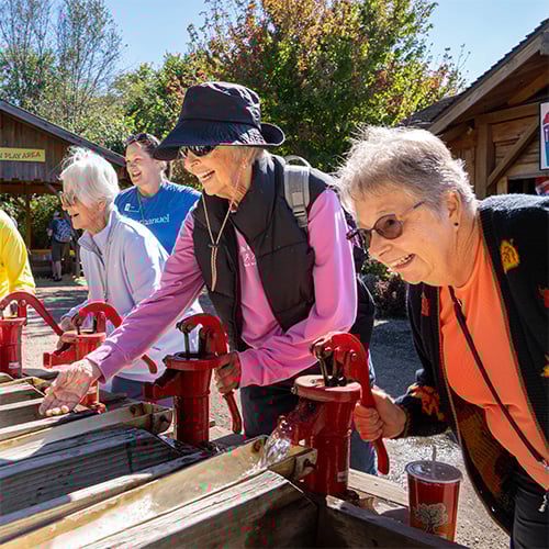 Senior woman playing game at Vala's Pumpkin Patch.