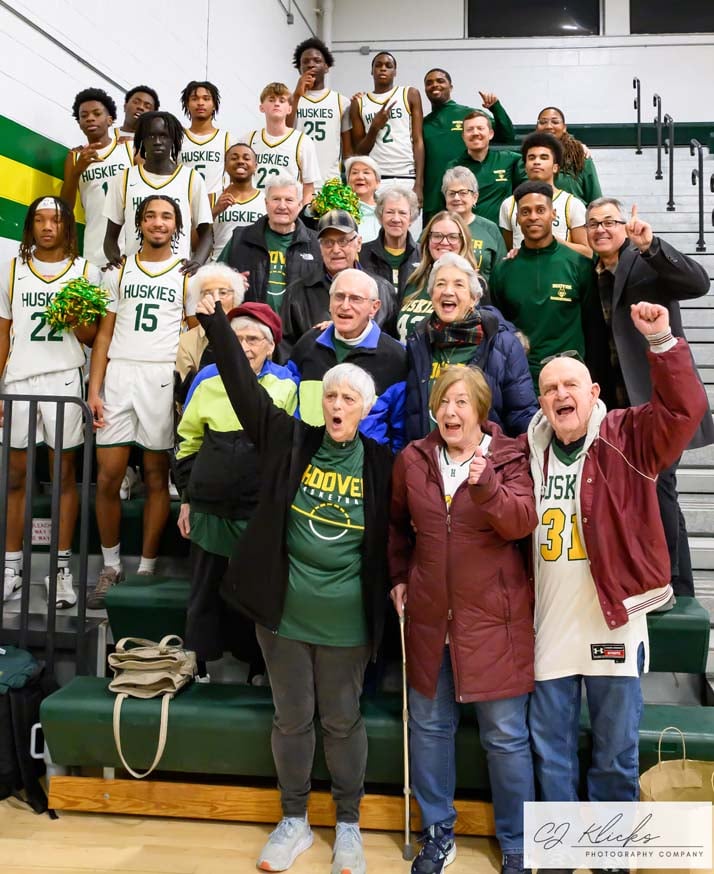 Photo by CJ Klicks Photography® - Deerfield retirement living community residents cheer on the Hoover High School boys basketball team.