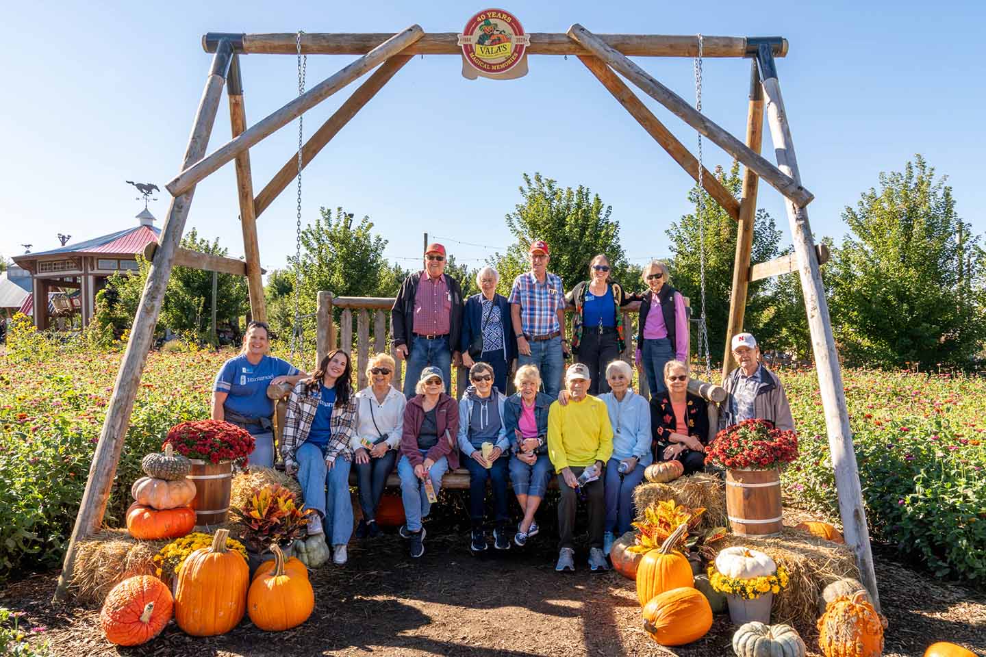 A group of seniors and staff members smiling
